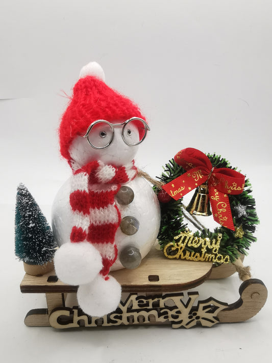 Cute Snowman on a Sleigh Christmas Ornament