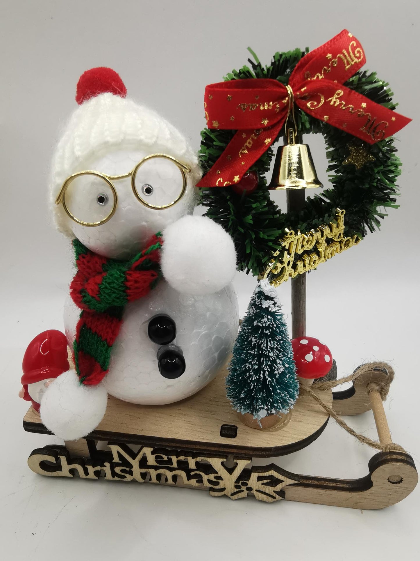 Cute Snowman on a Sleigh Christmas Ornament